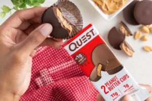 person holding Quest Keto snack bar