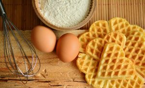 2 eggs, flour, and waffles