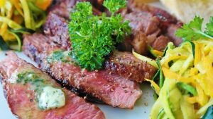 steak with parsley and noodles