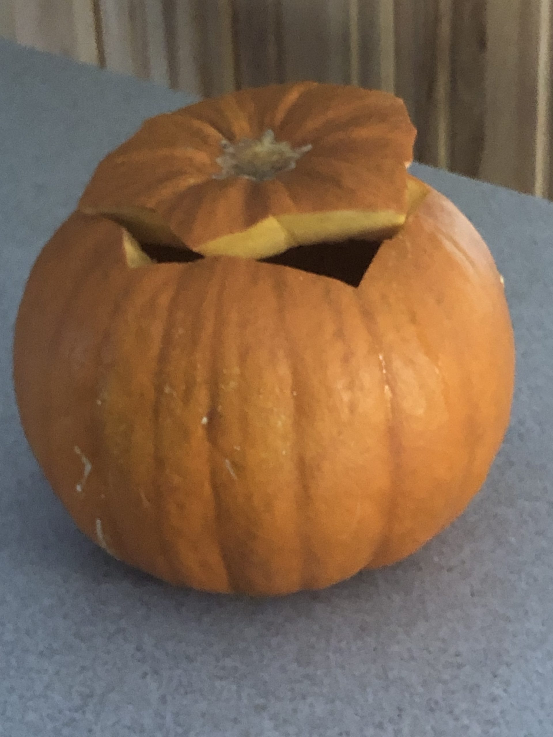 orange pumpkin with the top cut off